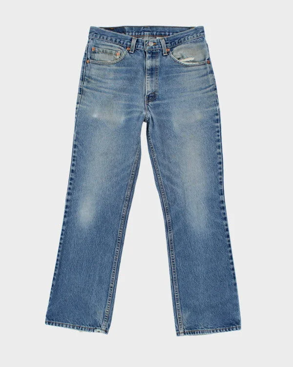 Vintage Levi's 517 Medium Wash Jeans - W32 L30 Fashionable Frayed Hem Denim